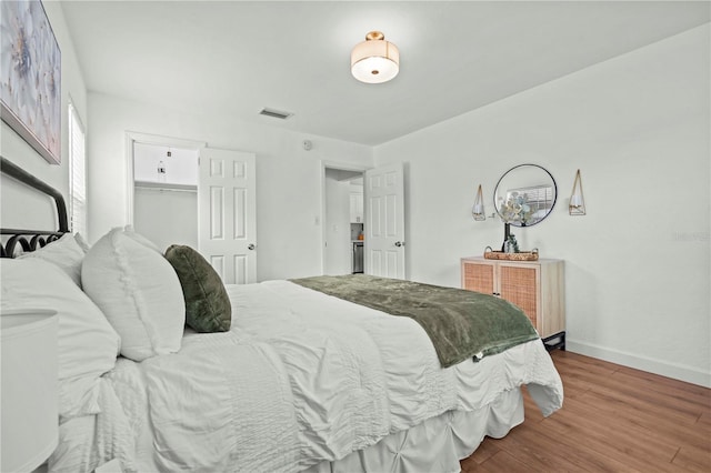 1743 Fulton Ave, Clearwater, FL 33755 - bedroom featuring baseboards and wood finished floors
