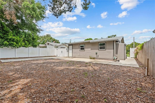 1743 Fulton Ave, Clearwater, FL 33755 - back of property featuring a patio and a fenced backyard