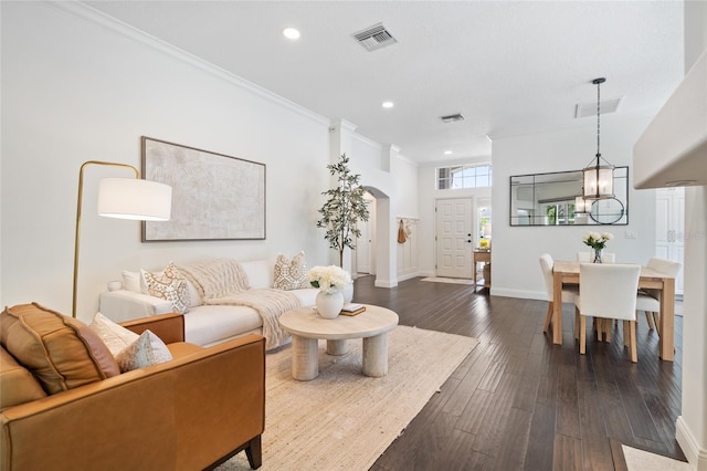 2182 Trevor Rd, Palm Harbor, FL 34683 - living area with recessed lighting, dark wood finished floors, arched walkways, and ornamental molding