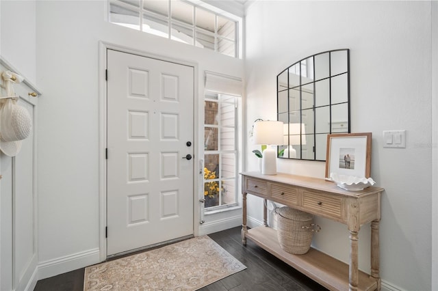 2182 Trevor Rd, Palm Harbor, FL 34683 - foyer entrance featuring baseboards and dark wood-style floors