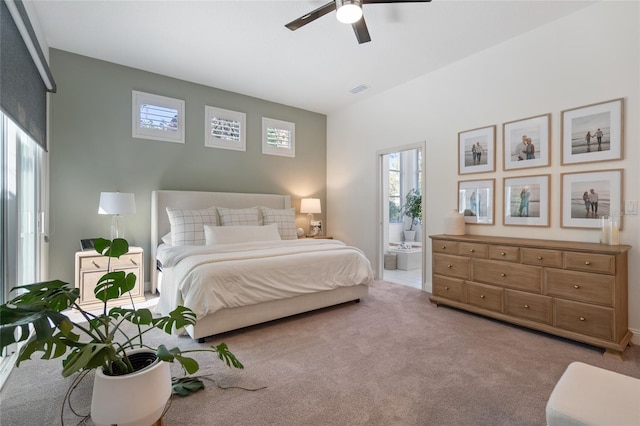 2182 Trevor Rd, Palm Harbor, FL 34683 - bedroom with multiple windows, carpet flooring, ensuite bath, and a ceiling fan