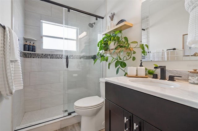 2182 Trevor Rd, Palm Harbor, FL 34683 - bathroom with vanity, a stall shower, and wood finished floors