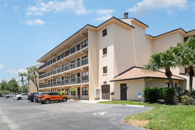 635 30th Ave W Unit F309, Bradenton, FL 34205 - view of apartment building / complex with uncovered parking