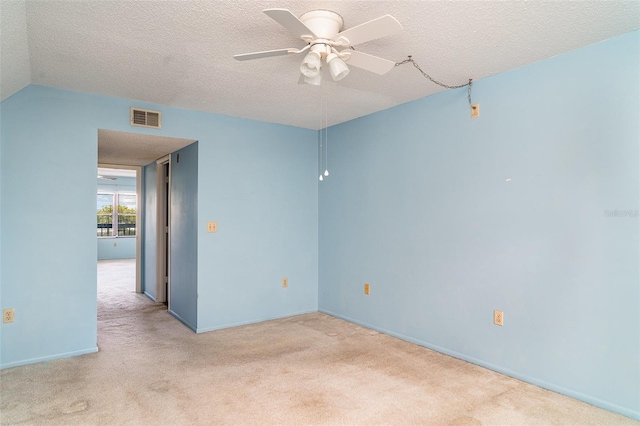 635 30th Ave W Unit F309, Bradenton, FL 34205 - empty room with carpet flooring, ceiling fan, and a textured ceiling