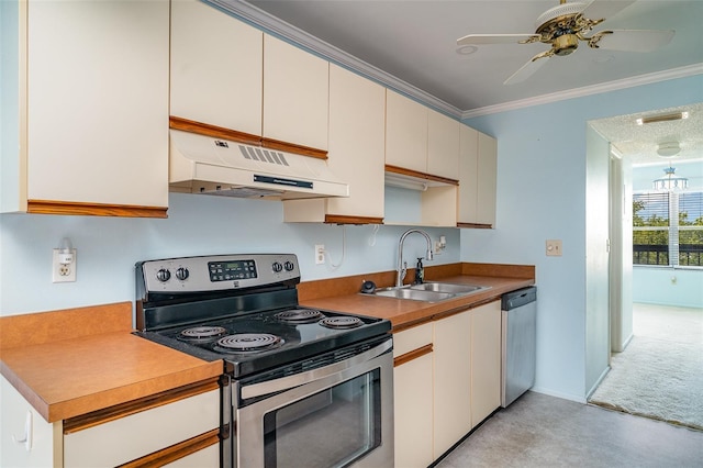 635 30th Ave W Unit F309, Bradenton, FL 34205 - kitchen with stainless steel appliances, under cabinet range hood, crown molding, a ceiling fan, and light countertops