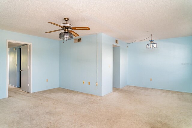 635 30th Ave W Unit F309, Bradenton, FL 34205 - unfurnished room featuring carpet, a ceiling fan, and a textured ceiling