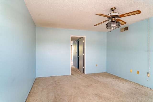635 30th Ave W Unit F309, Bradenton, FL 34205 - spare room featuring ceiling fan, carpet flooring, and a textured ceiling
