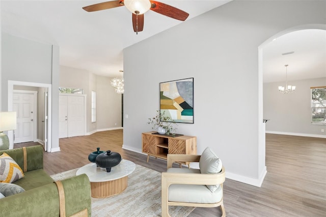 19113 Golden Cacoon Pl, Lutz, FL 33558 - living area featuring a chandelier, wood finished floors, and ceiling fan