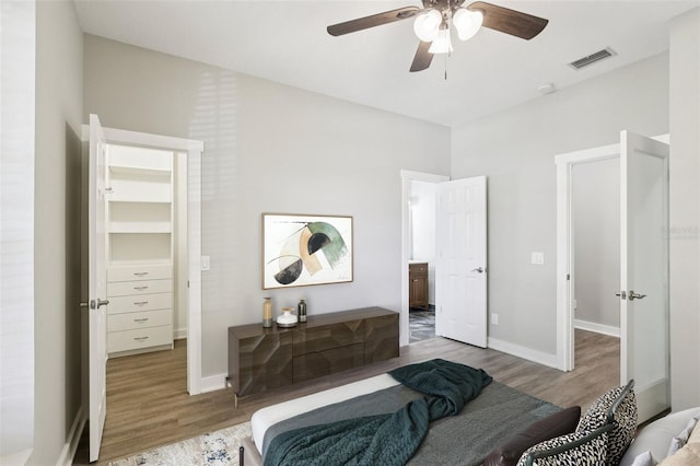 19113 Golden Cacoon Pl, Lutz, FL 33558 - bedroom featuring wood finished floors and a ceiling fan
