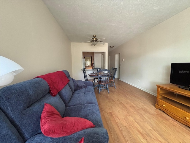 223 Windsor St Unit 6, Lakeland, FL 33803 - living area featuring light wood-type flooring, ceiling fan, and a textured ceiling