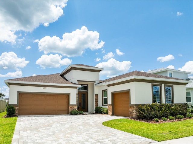 8749 Drummer Plank Dr, Wesley Chapel, FL 33545 - prairie-style home featuring a garage and stucco siding