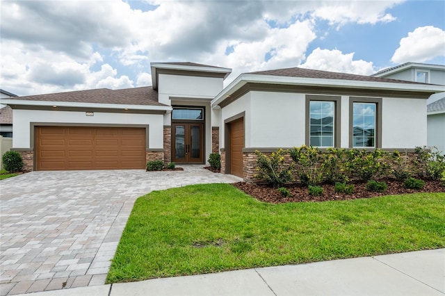 8749 Drummer Plank Dr, Wesley Chapel, FL 33545 - view of front facade with stone siding, stucco siding, a garage, and a front lawn