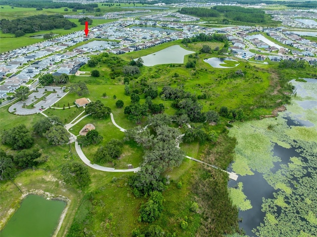8749 Drummer Plank Dr, Wesley Chapel, FL 33545 - aerial view of property and surrounding area with a nearby body of water and nearby suburban area