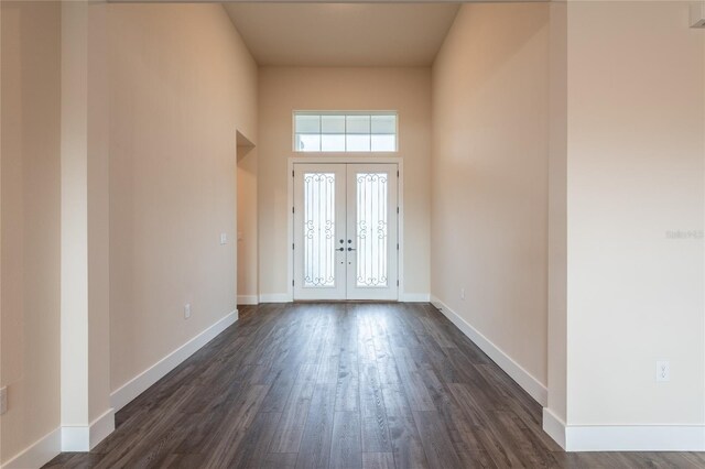 8749 Drummer Plank Dr, Wesley Chapel, FL 33545 - foyer with healthy amount of natural light, french doors, dark wood-type flooring, and a towering ceiling