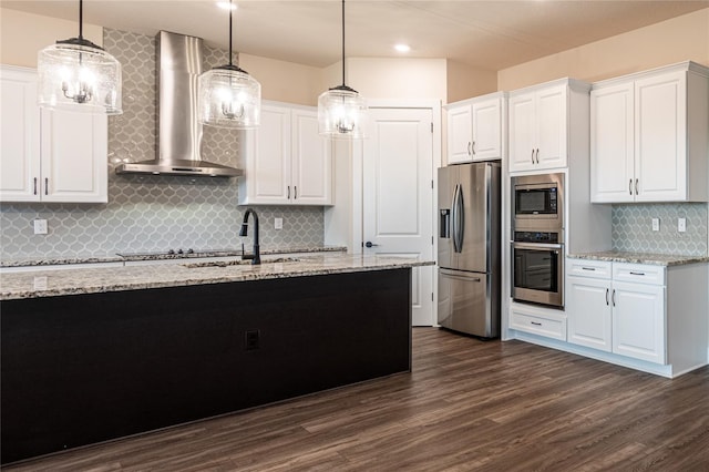 8749 Drummer Plank Dr, Wesley Chapel, FL 33545 - kitchen with appliances with stainless steel finishes, wall chimney range hood, tasteful backsplash, white cabinets, and dark wood-style flooring