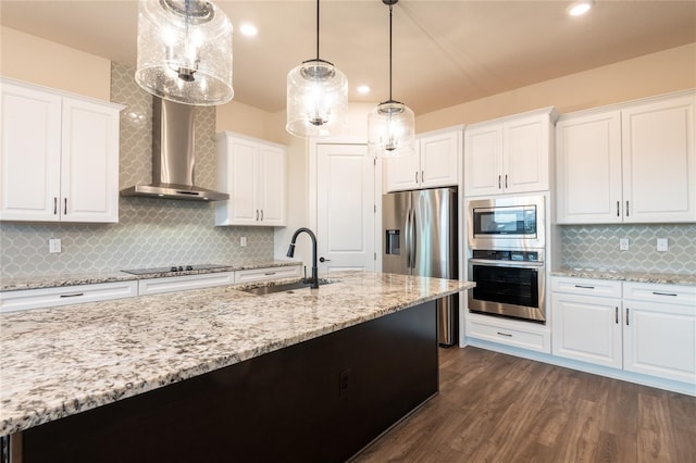8749 Drummer Plank Dr, Wesley Chapel, FL 33545 - kitchen with appliances with stainless steel finishes, white cabinetry, tasteful backsplash, light stone countertops, and pendant lighting