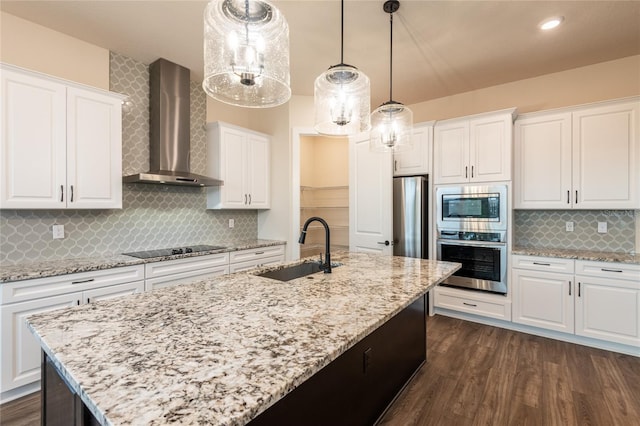 8749 Drummer Plank Dr, Wesley Chapel, FL 33545 - kitchen featuring wall chimney exhaust hood, appliances with stainless steel finishes, white cabinetry, an island with sink, and dark wood-style floors