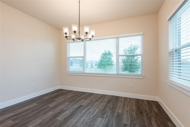 8749 Drummer Plank Dr, Wesley Chapel, FL 33545 - unfurnished room featuring a chandelier, plenty of natural light, and dark wood-type flooring