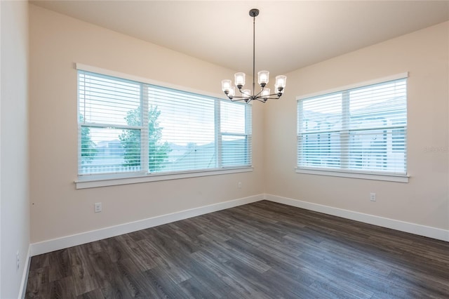 8749 Drummer Plank Dr, Wesley Chapel, FL 33545 - empty room featuring a chandelier and dark wood-type flooring