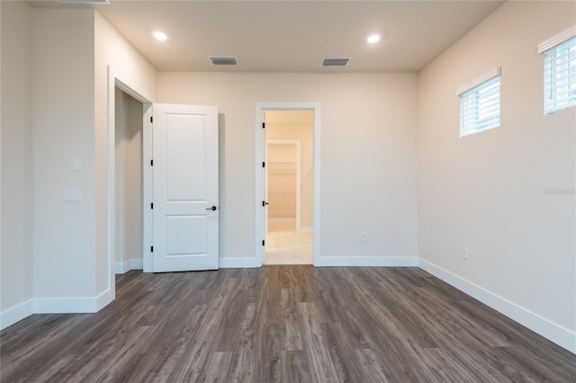 8749 Drummer Plank Dr, Wesley Chapel, FL 33545 - unfurnished bedroom featuring dark wood-type flooring and recessed lighting