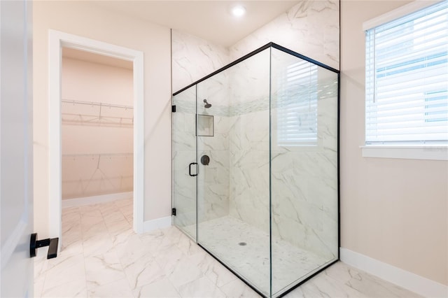 8749 Drummer Plank Dr, Wesley Chapel, FL 33545 - full bath with a marble finish shower, marble finish flooring, healthy amount of natural light, and a walk in closet