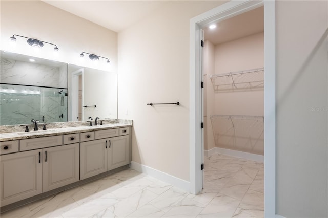 8749 Drummer Plank Dr, Wesley Chapel, FL 33545 - bathroom featuring marble finish flooring, a marble finish shower, a walk in closet, and double vanity