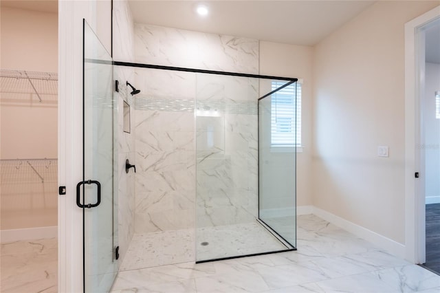 8749 Drummer Plank Dr, Wesley Chapel, FL 33545 - bathroom featuring marble finish flooring, a marble finish shower, a spacious closet, and recessed lighting