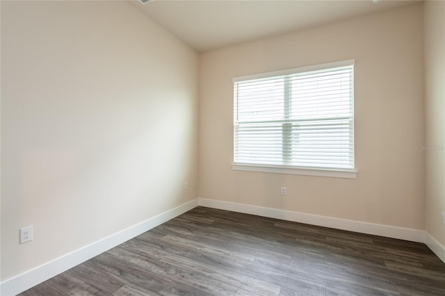8749 Drummer Plank Dr, Wesley Chapel, FL 33545 - empty room with baseboards and dark wood-style flooring