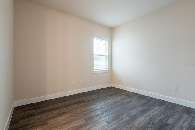 8749 Drummer Plank Dr, Wesley Chapel, FL 33545 - spare room with dark wood-type flooring and baseboards
