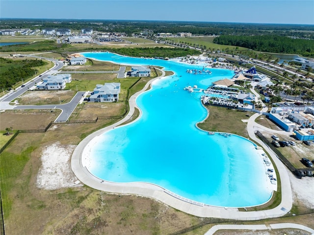 8749 Drummer Plank Dr, Wesley Chapel, FL 33545 - drone / aerial view of a pool area and a nearby body of water