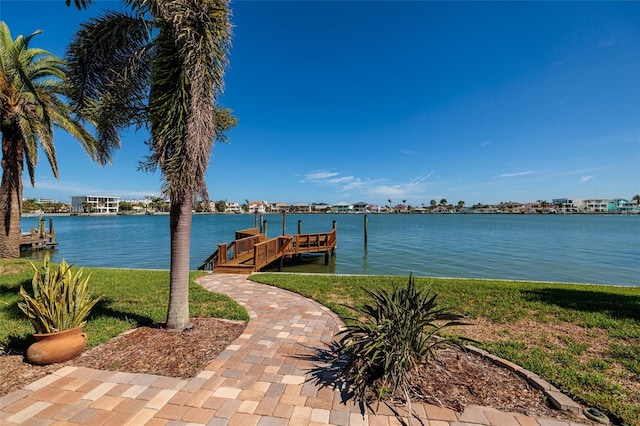 208 Bath Club Blvd N, North Redington Beach, FL 33708 - dock area with a water view and a yard