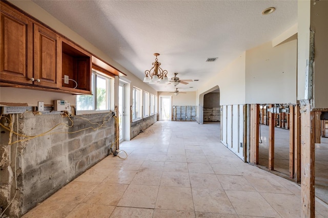 208 Bath Club Blvd N, North Redington Beach, FL 33708 - corridor with a chandelier
