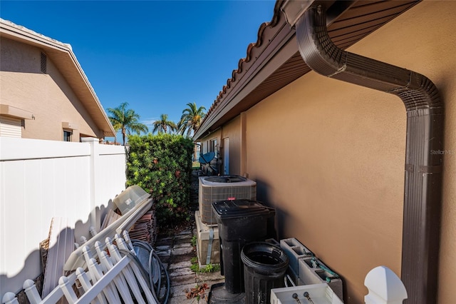 208 Bath Club Blvd N, North Redington Beach, FL 33708 - view of property exterior featuring stucco siding and a central air condition unit