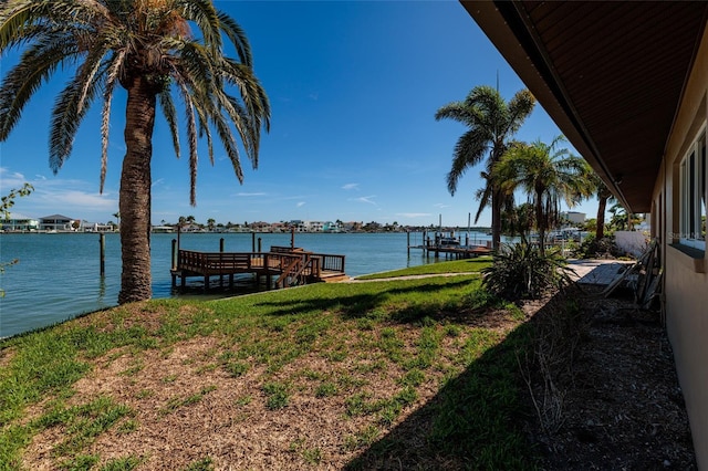 208 Bath Club Blvd N, North Redington Beach, FL 33708 - dock featuring a water view and a lawn