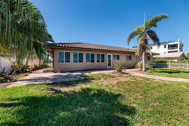 208 Bath Club Blvd N, North Redington Beach, FL 33708 - back of property with stucco siding, a tile roof, and a patio area