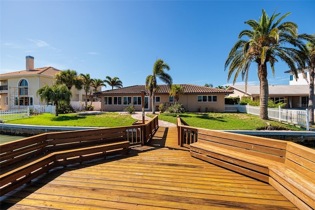 208 Bath Club Blvd N, North Redington Beach, FL 33708 - back of house with a fenced backyard, stucco siding, and a wooden deck