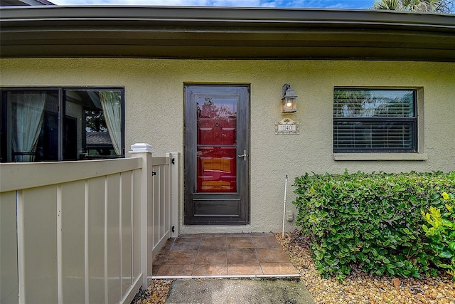140 Dale Pl, Oldsmar, FL 34677 - doorway to property featuring stucco siding