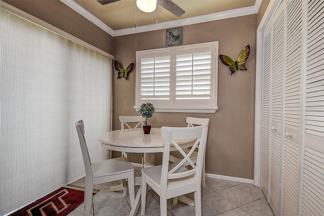 140 Dale Pl, Oldsmar, FL 34677 - dining room with ornamental molding, ceiling fan, and light tile patterned flooring