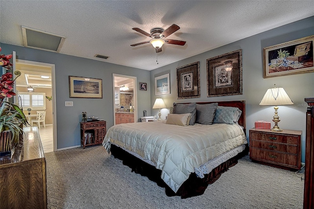 140 Dale Pl, Oldsmar, FL 34677 - bedroom with carpet flooring, a textured ceiling, connected bathroom, and a ceiling fan