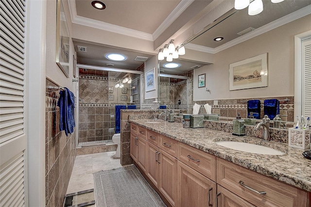 140 Dale Pl, Oldsmar, FL 34677 - bathroom featuring double vanity, a shower stall, and ornamental molding
