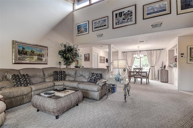 140 Dale Pl, Oldsmar, FL 34677 - carpeted living room featuring a chandelier and a towering ceiling