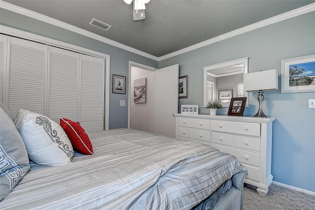 140 Dale Pl, Oldsmar, FL 34677 - bedroom with a closet, light colored carpet, ornamental molding, ceiling fan, and a textured ceiling