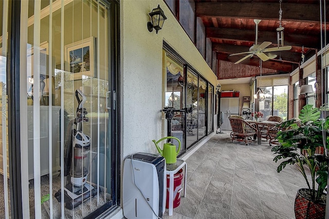 140 Dale Pl, Oldsmar, FL 34677 - sunroom / solarium with ceiling fan, wood ceiling, and stone finish flooring