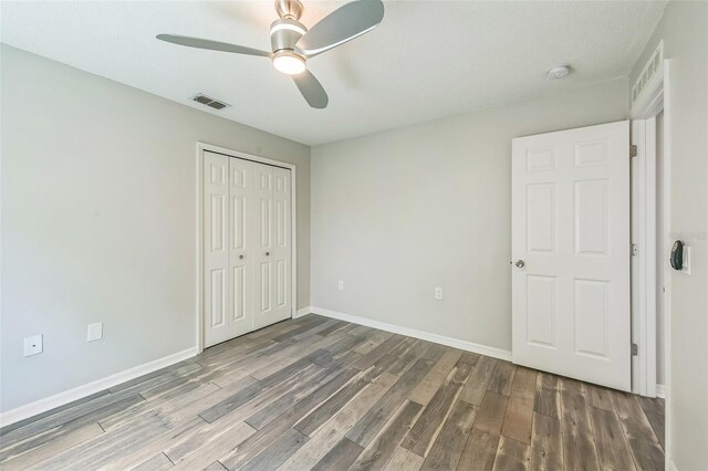 11130 Summer Star Dr, Riverview, FL 33579 - unfurnished bedroom featuring wood finished floors, a closet, and ceiling fan