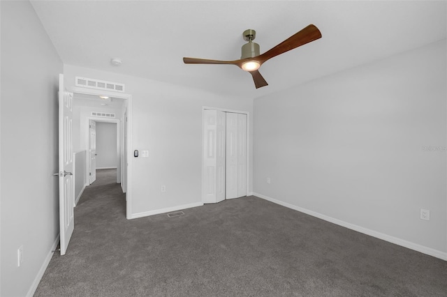 11130 Summer Star Dr, Riverview, FL 33579 - unfurnished bedroom with dark carpet, a ceiling fan, and a closet