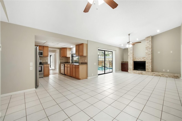 9807 Stephenson Dr, New Port Richey, FL 34655 - unfurnished living room with a ceiling fan, a fireplace, vaulted ceiling, light tile patterned floors, and recessed lighting