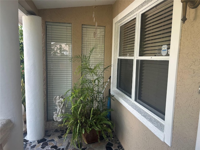 5106 Gateway Dr, Tampa, FL 33615 - doorway to property featuring stucco siding