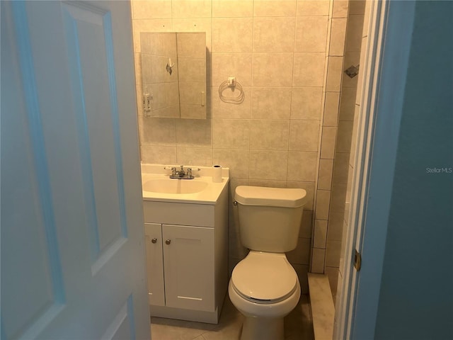 5106 Gateway Dr, Tampa, FL 33615 - bathroom featuring vanity, tile walls, and tile patterned flooring