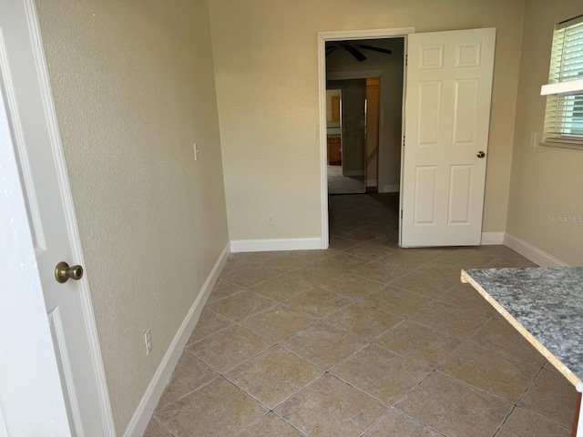 5106 Gateway Dr, Tampa, FL 33615 - tiled empty room with baseboards