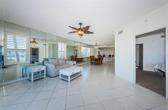 16600 Gulf Blvd Unit 437, North Redington Beach, FL 33708 - living room with ceiling fan, light tile patterned floors, and crown molding